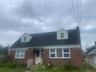 Brick facade with white window frames