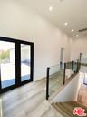 glass staircase on upper level