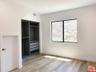 guest bedroom with mirrored cl
