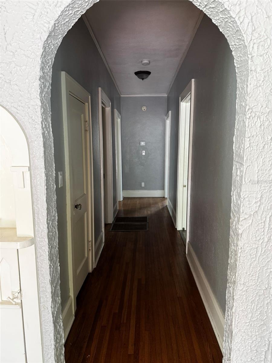 Downstairs Hallway to Hallway bath room, two bedrooms and Kitchen