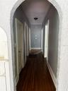 Downstairs Hallway to Hallway bath room, two bedrooms and Kitchen