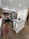 The island gives you more storage and area for meal prep. Large pantry and plenty of cabinet space!