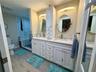 Master bath with all the custom upgrades! Walk-in shower with bench, dual vanities and sinks and a huge walk-in master closet!