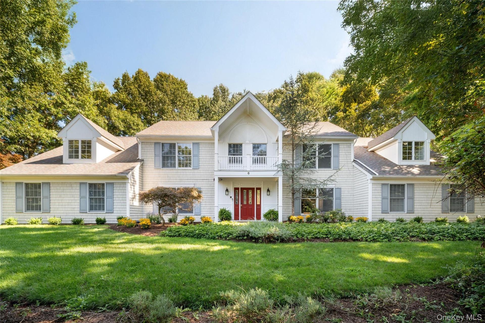 Set on a 1-acre desirable culdesac block offering waterviews of the LI Sound