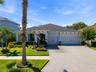 Original-owner home with a 3-car garage, paver driveway and thoughtfully upgraded landscaping.