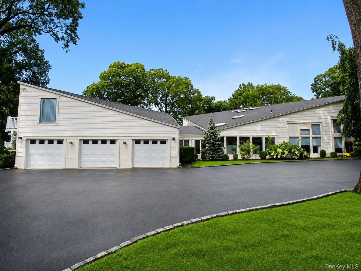 Fully renovated Residence featuring 3-Car Garage and Gated Circular Driveway