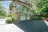 Stone and siding exterior with a two-car garage