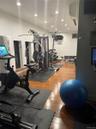 Gym featuring hardwood / wood-style floors and recessed lighting