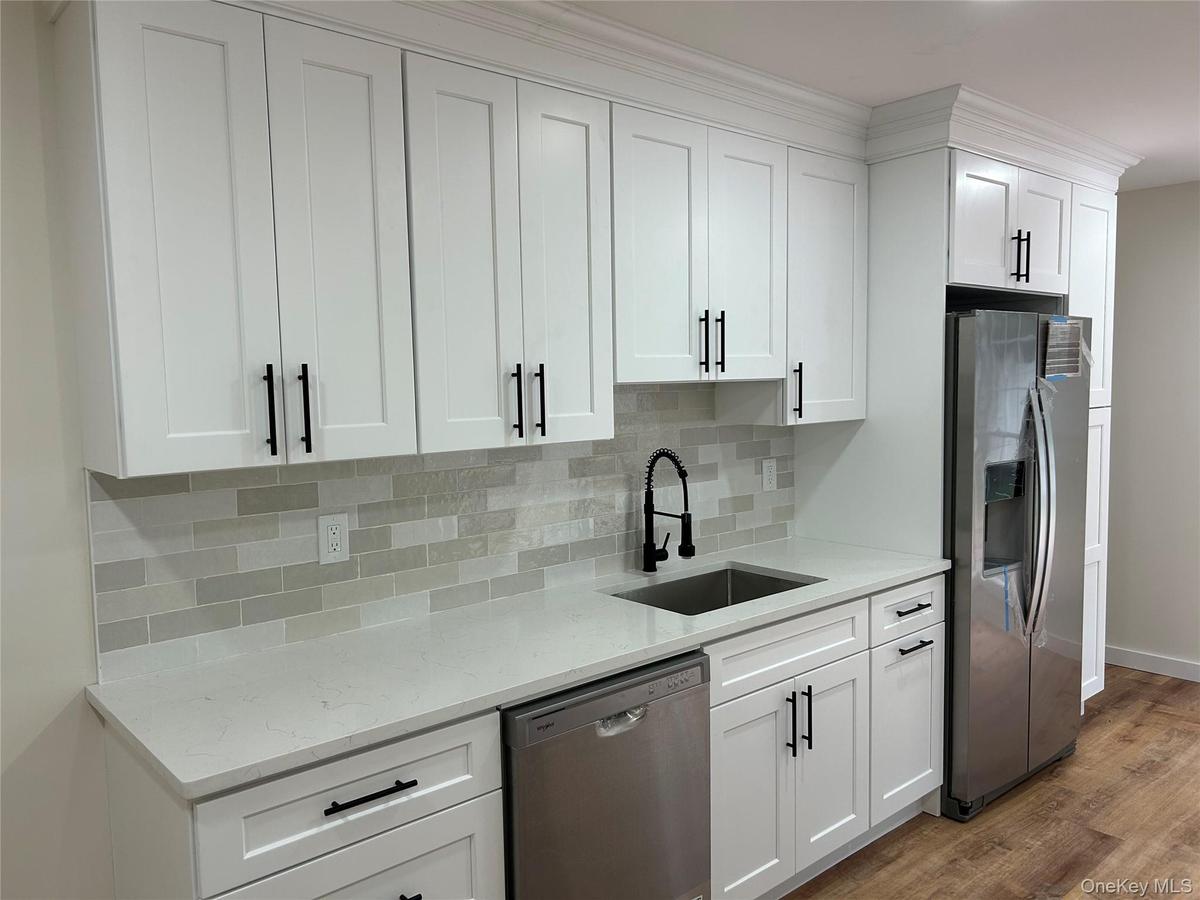 New soft close cabinets, Quartz countertops and stainless steel appliances
