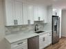 New soft close cabinets, Quartz countertops and stainless steel appliances