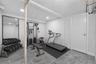 Virtually staged gym in basement area