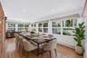 Virtually staged dining room area in Sunroom