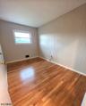 Bedroom w Refinished Floor