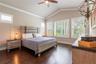 Spacious primary suite overlooking the backyard and conservation area.