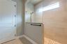 Large walk-in shower. The door leads into the walk-in closet.