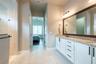 The primary en-suite has a spacious linen closet.