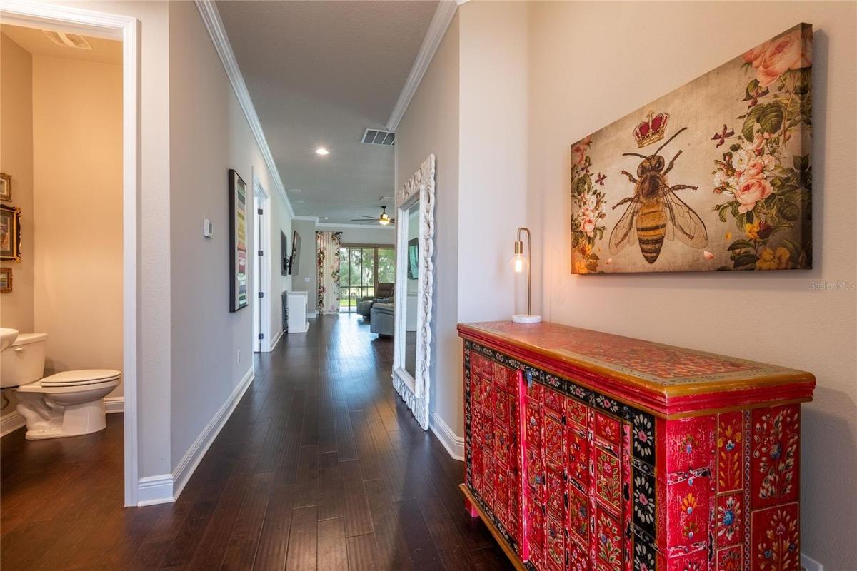 Enter into this foyer with a half bath and a bed with an en-suite bath.