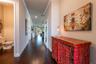 Enter into this foyer with a half bath and a bed with an en-suite bath.