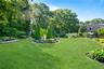 Circular garden bed filled with a variety of vibrant perennial flowers.