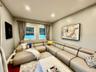 Family room with flat screen TV, opens to outdoor deck