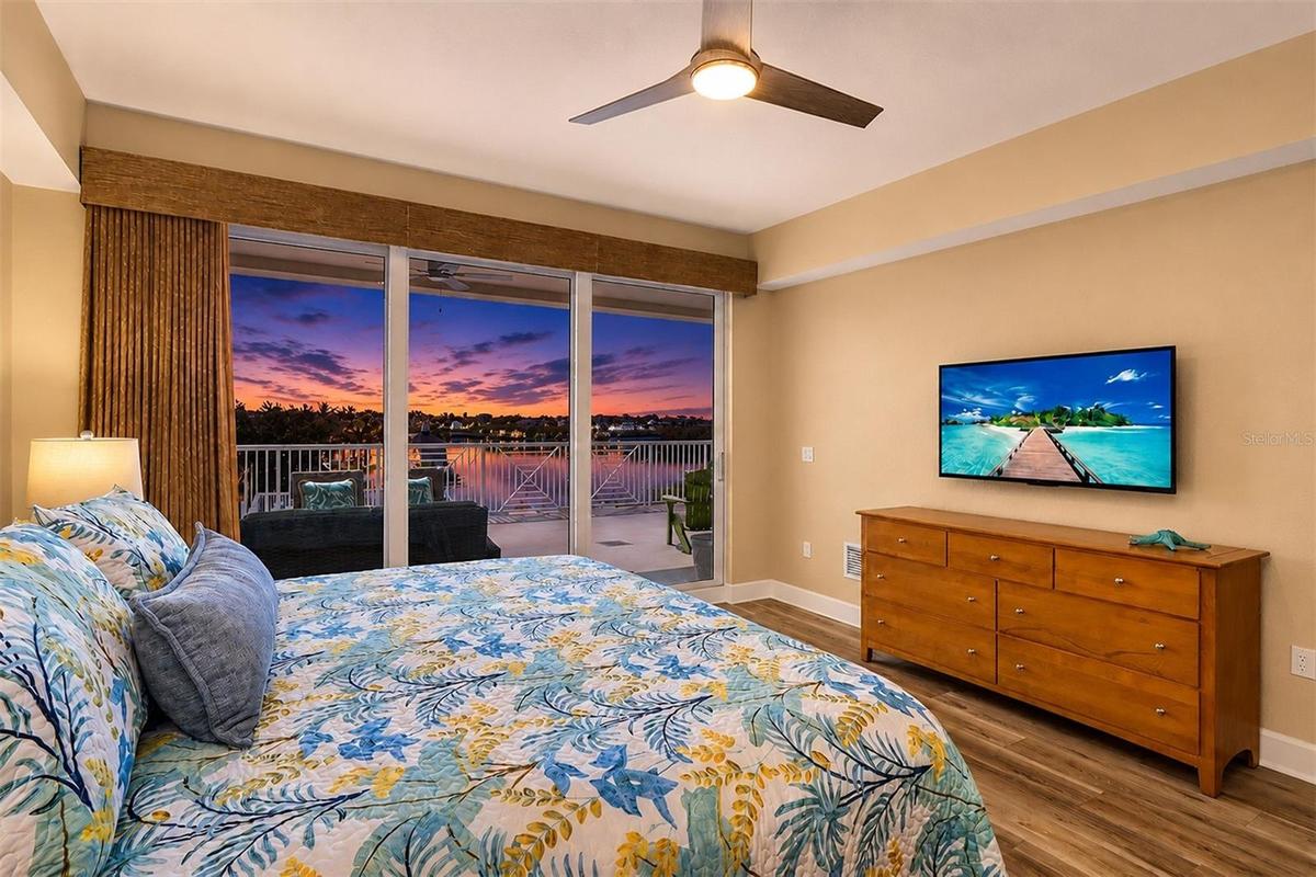 ...MASTER BEDROOM TWILIGHT WATER VIEW..