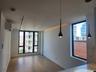 Recessed lighting, track lighting, pendant lighting, wood-finish flooring, and a built-in air conditioning unit