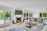 Living room with access to deck and water views