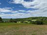 View of wooded area featuring a view of rural / pastoral area