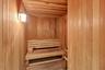 The wood-lined sauna adds another wellness amenity within the Tiara community.