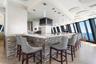 Bar seating at Tiara’s Marque restaurant offers a relaxed setting for drinks and dining, surrounded by elevated water views.