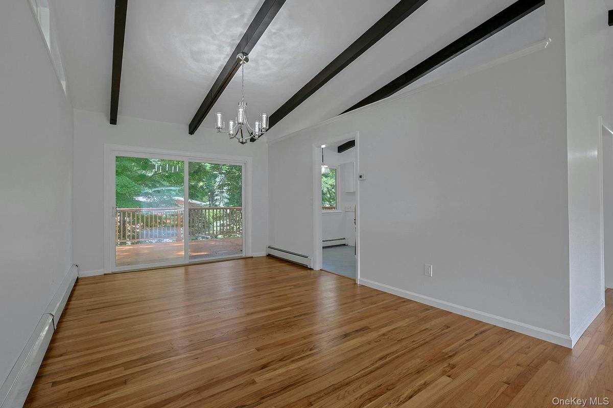 Spacious dining room with sliders to the oversized deck