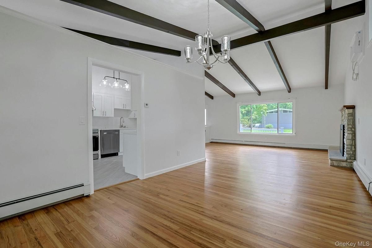 Another view of the dining room looking into the kitchen and living room showcasing the open floor plan
