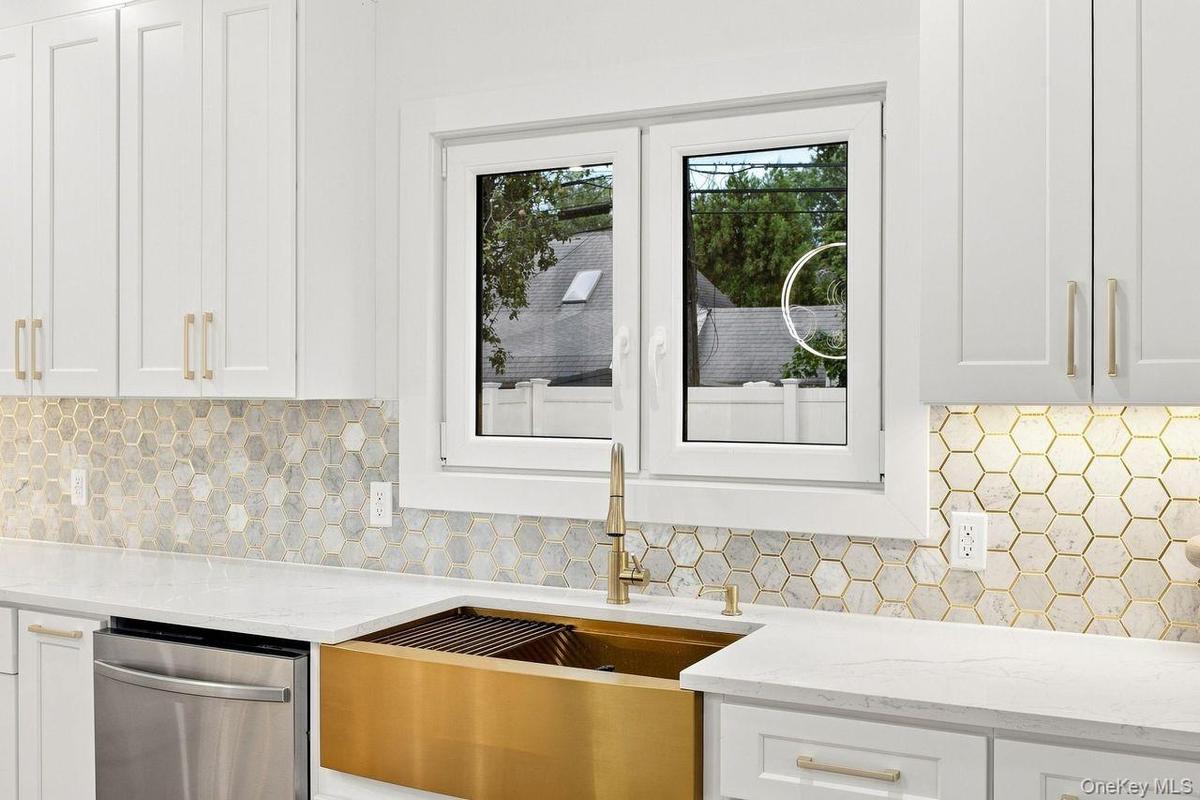 GOLD SINK for Good Luck and High Style! Gorgeous marble tile backsplash with Gold accents!