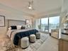 Primary bedroom with balcony access