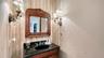 Half bath between kitchen and bedrooms is also convenient to the elevator.
