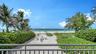View from the living room of the private beach and the public beach past the sea oats.