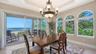 Formal dining area can accommodate a larger table and chairs comfortably.