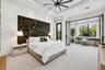Primary bedroom with private access to the backyard (AS IS). Glass doors