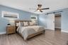 Spacious primary suite includes a large walk-in closet and a beautifully designed en-suite bath.