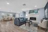 Open living and dining areas feature luxury vinyl plank flooring and a light coastal-inspired design.