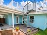 Spiral staircase leads to the home's charming widow's walk with water views and a 360-degree vantage point.