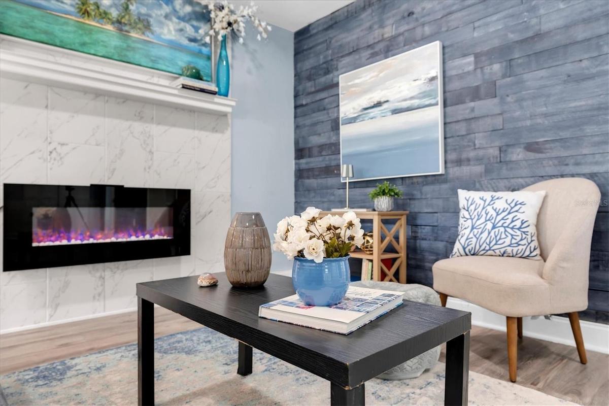 Marble-surround fireplace creates a stylish focal point for the living area.