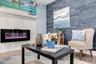Marble-surround fireplace creates a stylish focal point for the living area.