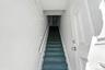 Stairway featuring concrete block wall