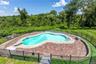 Step outside into your own private resort-style retreat, where sun-filled afternoons by the freeform swimming pool, leisurely lounging on the expansiv