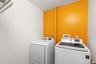 Conveniently located on the upper level, the laundry room adds ease and practicality to everyday living, just steps from the bedrooms.