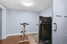 Currently enjoyed as an exercise room, this versatile space can easily accommodate a home office, yoga studio, or craft room. Rich, dark wood-toned fl
