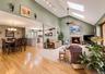 Living rm with Fireplace, Skylights, vaulted ceilings recessed & track lighting.