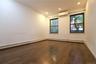 Hardwood flooring, recessed lighting, two double-hung windows, and a wall-mounted mini-split system