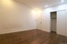 Wood-finish flooring, recessed lighting, white walls, and a built-in closet with sliding doors